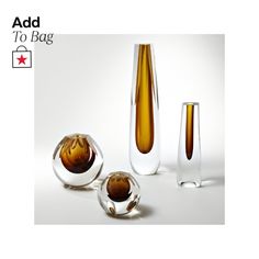 three glass vases sitting next to each other on a white surface with the words add to bag above them