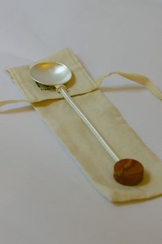 a spoon sitting on top of a piece of cloth