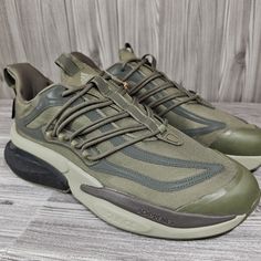 Elevate Your Athletic Style With These Adidas Alphaboost V1 Cordura Olive Strata Reflective Shoes In Men's Size 11. Crafted From High-Quality Synthetic Materials, These Athletic Sneakers Are Perfect For Any On-The-Go Activity. The Shoes Feature A Stylish Green Color, Along With Reflective Details That Add An Extra Touch Of Flair To Your Look. The Shoes Also Come With A Range Of Features, Including A Medium Shoe Width, 100% Authenticity Guaranteed, And A Product Line Of Alphaboost V1. Whether You Adidas Sneakers With Air Cushioning For Training, Adidas Sneakers With Air Cushioning For Outdoor, Adidas Training Sneakers With Air Cushioning, Adidas Running Shoes With Rubber Sole, Adidas Breathable Low-top Walking Shoes, Adidas Outdoor Sneakers With Air Cushioning, Functional Adidas Low-top Walking Shoes, Adidas Functional Low-top Walking Shoes, Adidas Functional Running Shoes With Rubber Sole