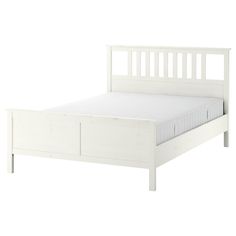 a white bed frame with two drawers on the bottom and one drawer at the end