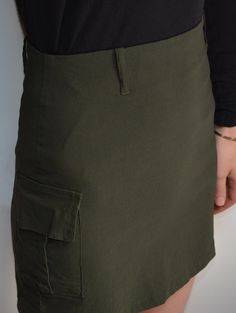 Cool vintage skirt made of stetchy, matte fabric in army green tone. Mini length, high waisted pencil fit. Belt loops. Cargo pocket on the side. Closes with hidden zip on the back. Era: 90's Fabric: 64% polyester, 30% viscose, 6% elasthane Condition: very good Estimated size: S (please, check the measurements) Measurements (measured flat, need to be doubled to get the circumference): Waist (unstretched): 32 cm / 12,6 inches Hips: 42 cm / 16,5 inches Length: 40 cm / 15,7 inches Fitted Utility Shorts, Fitted Utility Cargo Shorts, Khaki Cargo Skirt With Side Pockets For Work, Fitted Khaki Cargo Skirt For Spring, Fitted Cargo Style Utility Shorts, Fitted Utility Cargo Style Shorts, Fitted Khaki Shorts For Work, Fitted Short Cargo Skirt In Utility Style, Fitted Utility Cargo Skirt In Short Length