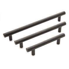 three black cabinet handles on a white background