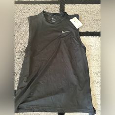 Brand New Nike Dri Fit Shirt. Black Sleeveless Workout Top, Sleeveless Cotton Nike Top, Nike Sporty Sleeveless Vest, Black Fitted Sleeveless T-shirt, Nike Sporty Sleeveless Tops, Nike Black Sleeveless Top, Nike Casual Sleeveless Vest, Nike Sleeveless Tops For Summer, Nike Sleeveless Summer Tops