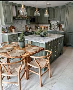 a kitchen with green cabinets and wooden chairs