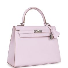 This Kelly, in the Sellier style, is in Mauve Pale epsom leather with palladium hardware and has tonal stitching, two front straps with toggle closure, clochette with lock and two keys, single rolled handle and removable shoulder strap.The interior is lined with Mauve Pale chevre leather and has one zip pocket with an Hermes engraved pull and one open pocket on the opposite side.Collection: UOrigin: FranceCondition: New and never worn (plastic on hardware)Accompanied by: Hermes box, dustbag, clo Hermes Kelly Pink, Pink Kelly Bag, Hermes Collection, Hermes Kelly Sellier, Pink Kelly, Kelly Sellier, Cotton Candy Colors, Luxury Bags Collection, Chanel Brand