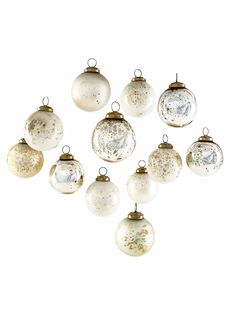 PRICES MAY VARY. BEAUTIFUL AND UNIQUE DECORATION - Bring some glamour in your home with our white & silver glass balls ornaments. We are in love with these glass ball ornament and makes it an eye-catching piece of any décor. MULTIPLE USECASES - These ornaments can be used for multiple purposes in decorating your Christmas tree or wreath or for placing them in a window box. Consider gathering a mix of Christmas ornaments from our collection into a bowl for a dinner table centerpiece. MIX AND MATCH - Look out for our other holiday products that you can choose to pair with these shiny ornaments and create a unique and beautiful design for your holiday décor. PERFECT HOLIDAY DÉCOR - Perfect home decor for Christmas, wedding, engagement, anniversary, party, as hanging ornaments on tree branches Modern Christmas Ornaments, Decorated Wreaths, Glass Ball Ornaments, Christmas Decorations For The Home, Mercury Glass, Gold Glass