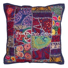 an embroidered pillow with many different colors and designs on the front, side and back