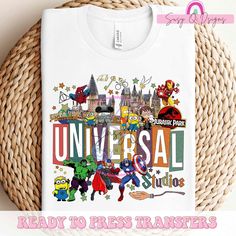 a t - shirt with the words universal and cartoon characters on it in front of a woven basket