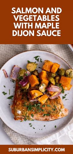 salmon and vegetables with maple dijon sauce on a white plate next to an orange napkin