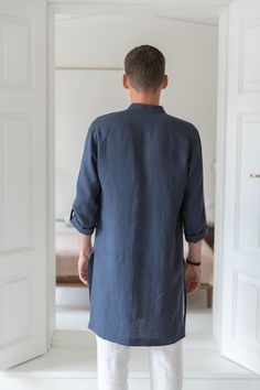 "A classic style redefined with modern styling, we created a linen tunic for men to fill that gap in your everyday wardrobe. The linen shirts are breathable and durable to provide maximum comfort, and they've kept it simple with roll-up sleeves and button-up closure. Step out in style no matter the occasion with a little help from our signature linen tunic. Handmade by masters of their craft in Lithuanian, where skills have been passed down for generations, your wardrobe's latest addition is sur Casual Linen Kurta With Relaxed Fit, Relaxed Fit Long Sleeve Linen Kurta, Casual Linen Kurta For Summer, Casual Linen Kurta Tunic, Summer Linen Kurta With Relaxed Fit, Casual Linen Tunic Kurta, Summer Linen Kurta Tunic, Summer Linen Tunic Kurta, Spring Linen Kurta With Relaxed Fit