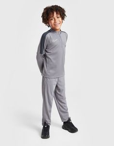 Get them set for the pitch with this children's Academy Track Top/Track Pants Set from Nike. In a Grey colourway, this JD-exclusive set is made with a smooth, lightweight polyester for lasting comfort. Engineered with sweat-wicking Dri-FIT tech for cool wear, it includes a long-sleeve track top with a stand-up collar and a quarter zip closure for a custom feel. The matching track pants have an elasticated waistband with a drawcord for a secure fit, and slim, tapered legs for a streamlined feel. Finished with signature Nike branding at the chest and leg. Machine washable. Nike Branding, Football Training, Grey Nikes, Jd Sports, Outdoor Style, Adidas Nike, Chucks Converse, Tapered Legs, No Equipment Workout