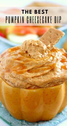 peanut butter dip in a pumpkin shaped bowl with crackers sticking out of the top