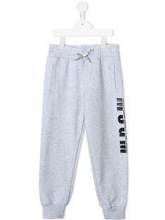 Light grey/black cotton logo print track pants from MSGM KIDS featuring logo print at the leg, elasticated waistband, drawstring fastening, two front patch pockets, rear patch pocket and elasticated ankles. | Msgm Kids Logo Print Track Pants Msgm Kids, Girl Sweatpants, Kids Logo, Cotton Logo, Tracksuit Bottoms, Kids House, Logo Print, Kids Boys, Track Pants