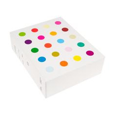 a white box with multi colored dots on it