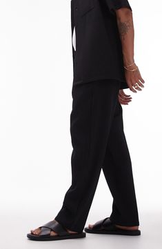 Textural rib lends depth to these edgy wide-leg trousers topped by a comfy elastic waist. 26 1/2" inseam; 14" leg opening; 13" front rise; 17 1/2" back rise (size Medium) Elastic waist Front slant pockets; back welt pockets 94% polyester, 6% elastane Machine wash, line dry Made in Turkey Casual Wide Leg Pants With Ribbed Waistband For Work, Black Wide-leg Pants With Ribbed Waistband, Black Pants With Straight Hem For Spring, Ribbed Workwear Pants, Black Straight Hem Pants For Spring, Ribbed Black Bottoms For Fall, Fall Black Ribbed Bottoms, Ribbed Relaxed Fit Straight Pants, Relaxed Fit Ribbed Pants