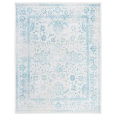 a light blue and white rug with an ornate design on the bottom, in front of a