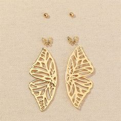 Bring a whimsical touch to your ensembles with this set of butterfly-themed stud and drop earrings boasting a chic 18k gold-plated finish. Includes one pair of ball stud, one pair of butterfly stud and one pair of butterfly wings drop earrings (three pairs total) Ball: 0.16" diameter Small butterfly: 0.31" W x 0.39" H Large butterfly: 0.98" W x 2.36" L 18k gold-plated copper Stainless Bracelet, Butterfly Stud Earrings, Crystal Hair Accessories, Small Butterfly, Hair Band Accessories, Crystal Jewelry Sets, Butterfly Earrings Stud, Hair Jewelry Wedding, Wing Earrings