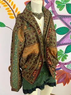 this silk jacket is a one of a kind!✨ hand picked vintage silk from special ethnic places to bring you the most beautiful silky and soft ones we could find 🌞 this jacket is like a piece of art, it has so many details and you will always be the only one to have it. it has a zipper, two front pockets and an inner zipper pocket️ jacket has an inner liar of fleece, so it will keep you cosy and warm in cold winter days. 🌱 you may find some small imperfections on the silk, this should be loved as a Green Bohemian Outerwear For Festival, Bohemian Long Sleeve Outerwear With Boho Print, Long Sleeve Boho Print Outerwear For Fall, Bohemian Winter Outerwear, Bohemian Boho Print Festival Outerwear, Green Long Sleeve Hippie Outerwear, Hippie Festival Long Sleeve Outerwear, Hippie Style Long Sleeve Festival Outerwear, Hippie Long Sleeve Festival Outerwear