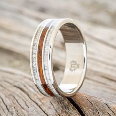 a wedding ring with wood and silver inlays