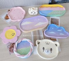 there are many different shaped trays on the table, including one with a bear