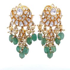 Experience the opulence of Traditional Indian style with our exquisite Chandbali Earring, expertly crafted in 925 Sterling silver and adorned with fine quality Moissanite, Green stone, and Pearls. This stunning piece radiates elegance and grace, transporting you to the vibrant world of Bollywood glamour.  With its high carat gold plating and push-back closure, this earring promises durability and a secure fit, perfect for any occasion. Whether dressing up or adding a touch of cultural flair to y Traditional Gemstone Chandelier Earrings For Weddings, Elegant Gemstone Chandbali Danglers, Chandbali Earrings With 17 Jewels For Wedding, Elegant Chandbali Gemstone Danglers, Elegant Chandbali Gemstone Earrings, Elegant Chandbali Bridal Earrings With Gemstones, Elegant Green Danglers For Reception, Elegant Sterling Silver Latkans Bridal Earrings, Elegant Sterling Silver Bridal Earrings With Latkans