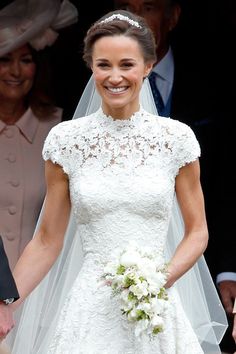 the bride smiles as she walks down the aisle at her wedding to prince william and kate