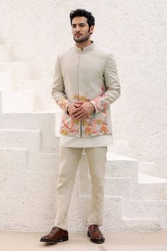 Beige bandhgala highlighted with resham floral embroidery. Paired with a short kurta and trouser.
Components: 3
Pattern: Embroidered
Type Of Work: Resham
Neckline: Band collar
Sleeve Type: Long
Fabric: Pure Linen
Color: Beige
Other Details: 
Approx. product weight: 1.3 kgs
Occasion: Mehendi and Puja - Aza Fashions Best Marriage Outfits For Men, Beige Jodhpuri Suits For Men, Long Jodhpuri For Men, Kurta With Blazer For Men, Mehendi Kurta For Men, Jhodpuri Suit For Men Wedding, Short Sherwani For Men, Beige Bandhgala, Wedding Dresses Men