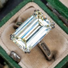 This substantial emerald cut diamond solitaire engagement ring contains one (1) emerald cut diamond weighing 8.00 carats and set into a four-split prong head. The ring measures 15.9mm at the top, rises 7.5mm above the finger, tapering to 2.3mm wide and 1.7mm thick at the base of the shank. The ring is currently size 6. Solitaire Engagement Ring Platinum, Wide Band Engagement Ring, Antique Cocktail Ring, Estate Jewelry Rings, Engagement Ring Platinum, Rings Antique, Marquise Diamond Engagement Ring, Emerald Cut Diamond Ring, Future Engagement Rings