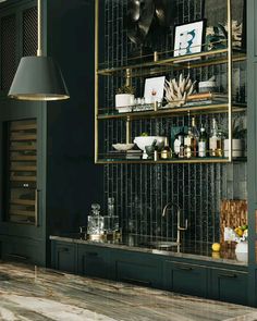 a kitchen with green cabinets and gold accents on the wall, along with an open shelving unit