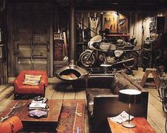 a living room filled with furniture and a motorcycle