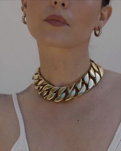 Our favorite statement chain shortened for THAT vibe. Choker measures 16" in length and 1.25" wide - 18k Gold plated Stainless Steel Estimated Ship Date: January 10th Chic Cuban Link Jewelry For Gift, Chic Cuban Link Jewelry Gift, Trendy Gold Plated Cuban Link Jewelry, Trendy Yellow Gold Curb Chain Necklace, Chic Curb Chain Jewelry As A Gift, Trendy Cuban Link Chain Jewelry, Gold Plated Clavicle Chain Necklace For Party, Metal Curb Chain Jewelry, Gold-tone Cuban Link Chain With Adjustable Detail