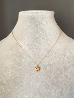 "A sweet and simple 24k solid matte gold vermeil heart charm dangles from a 14k gold filled chain. The chain is adjustable and can be worn close to the neck at 16\" or a little longer at 18\". It is finished with a spring ring clasp. Please send a message if a longer chain is desired. Wear this necklace by itself or as a layering piece. A perfect gift for Valentine's Day, birthday, anniversary or bridal party. Multiple quantities can be special ordered. Heart charm: 9x9mm Total length of pendant Chain With Heart Pendant, Simple Gold Heart Necklace, Small Gold Heart Necklace, Gold Chain With Heart Pendant, Simple Neck Chain Designs Gold, Small Pendant Necklace Gold, Gold Heart Pendant Necklace, Small Pendant Design, Small Chains Gold With Pendant