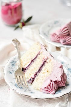 a piece of cake on a plate with a fork next to it and another slice in the background