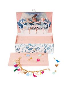 an open box with various items in it on a white background, including a necklace and earrings