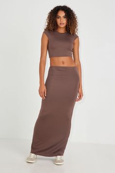 Okay she's versatile.. this hot convertible maxi skirt can also be worn as a sleeveless dress! Features - Slip-on - Semi-sheer - Stretchy Size & Fit - Rise: High-rise - Length: Maxi - Model is wearing size S Materials & Care - Content: 95% rayon, 5% spandex - Care: Machine wash, cold - Imported Brown Maxi Skirt, Brown Maxi Skirts, Softest Sweater, Mock Neck Sweater, Bottom Clothes, Crop Tee, Casual Fits, Summer Wardrobe, Convertible