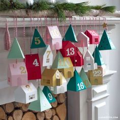 a bunch of mail boxes are hanging on the wall next to a firewood log