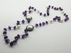 Amethyst is paired with a pearl in a necklace that is perfect for artists This is a stunning, natural necklace made from high-quality materials, amethyst, baroque pearls, Amethyst is associated with the Magical. Length 15 inç. ( 38 cm. ) Neck circumference 30 inç. (76 cm. ) Sending me requests and suggestions, please feel free to convo The product will be sent within a gift box and a gift bag For other inquiries, please visit the shop policies Thank you for visiting our shop http://www.etsy.com/ Silver Amethyst Necklace For Wedding, Wedding Amethyst Jewels Jewelry, Elegant Necklaces With Round Amethyst Beads, Elegant Purple Jewelry With Round Beads, Elegant Purple Necklace For Party, Elegant Long Pearl Necklace For Celebrations, Amethyst Necklaces For Wedding, Elegant Amethyst Necklace For Anniversary, Wedding Pearl Necklace With Gemstone