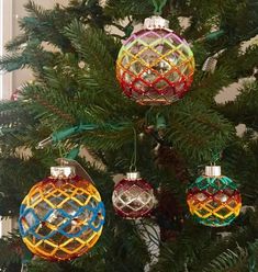 a christmas tree with ornaments hanging from it's branches