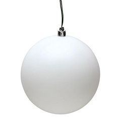 a white ball ornament hanging from a black cord