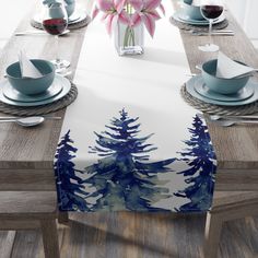 the table is set with blue and white placemats, napkins, and cups