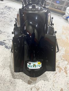 the back end of a motorcycle parked in a garage