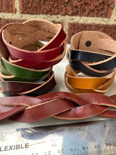 "Beautifully colored braided leather cuff bracelets in a variety of colors! Choose your color and send me a note with which ones you want. Dark blue, yellow, chocolate, green, red, brown.  They are thick, but not too thick, they soften the more you use them, they have a buffed wax finish and a sturdy snap. They are 8\" long (fits an average size wrist) but we can make to order if you need a bigger size.  100% real cowhide and guaranteed quality." Brown Braided Bangle Bracelets As Gift, Brown Braided Bracelet For Gifts, Brown Braided Bangle Bracelet For Gift, Brown Braided Bracelet For Gift, Casual Brown Cuff Bracelet As A Gift, Casual Brown Cuff Bracelet As Gift, Casual Brown Braided Bracelet, Handmade Brown Leather Friendship Bracelet, Leather Cuff Bracelets