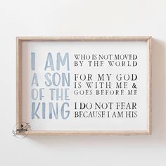 a framed print with the words i am not moved by the world in blue and white