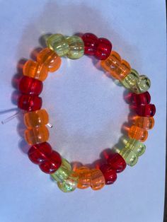 Red, yellow, orange fall themed bracelet  stretchy, unisex FREE SHIPPING Trendy Red Plastic Bracelet, Trendy Red Plastic Bracelets, Vibrant Yellow Beaded Bracelets As Gift, Colorful Casual Plastic Bracelets, Casual Orange Beaded Stretch Bracelet, Red Plastic Beaded Bracelets As Gift, Adjustable Red Beaded Plastic Bracelets, Vibrant Red Bracelets For Gift, Handmade Orange Stretch Bracelet