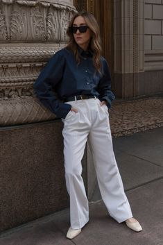 Oversized tailored shirt with drop shoulder. Box center pleat at back, with rounded hem and extended tail. Shell buttons. Oversized fit. Wear your normal size for an oversized fit or size down for a more traditional fit. Model is wearing an XS. 100% cotton. Gentle machine wash cold, inside out, with like colors. Lay flat to dry. Oversized Workwear Shirt, Oversized Cotton Blouse For Formal Occasions, Oversized Workwear Shirt With Concealed Placket, Oversized Classic Blouse For Business Casual, Oversized Tops With Button Cuffs For Business Casual, Classic Oversized Tops For Workwear, Oversized Classic Tops For Business Casual, Oversized Straight Hem Tops For Work, Oversized Tops For Workwear With Straight Hem