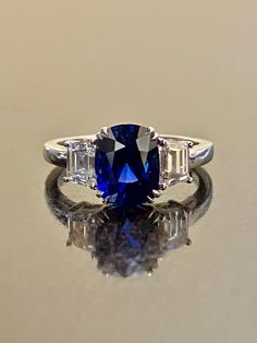 "DeKara Designs Collection Beautiful Modern/Art Deco Ceylon Blue Sapphire and Diamond Ring Metal- 90% Platinum, 10% Iridium Stones- Genuine Oval Ceylon/Sri Lanka Royal Blue Sapphire 3.75 Carats. Two Trapezoid Cut Diamonds F Color VS1 Clarity 1.09 Carats. Size-6 3/4. FREE SIZING Entirely Handmade, Classic and Timeless Art Deco Inspired Ceylon Oval Royal Blue Sapphire Diamond Engagement Ring. This ring is out of this world with the center Ceylon Sapphire being exceptional in quality, clarity, colo Blue Sapphire Engagement Ring Oval, Blue Sapphire Engagement Ring, Diamond Sapphire Engagement Ring, Sapphire Band, Ceylon Sapphire, Sapphire Engagement Ring Blue, Etsy Wedding Rings, Blue Sapphire Diamond, Sapphire Engagement Ring