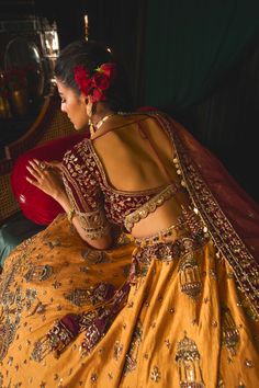 Step into refined elegance with a lehenga that exudes grace and tradition. This stunning piece is infused with a lively story, delicately embroidered on a raw silk lehenga skirt in vibrant mustard, showcasing intricate gold tarnished work, sequins, and old-world zardozi. The blouse, crafted from rich maroon velvet, features lush embroidery that beautifully complements the skirt. Paired with a delicate net dupatta that adds a crowning touch to this luxurious ensemble, this lehenga is truly every bride's dream, blending timeless elegance with contemporary charm. Mustard Lehenga, Raw Silk Lehenga, Lehenga Skirt, Silk Lehenga, Net Dupatta, Raw Silk, Old World, Innovation Design, Lehenga