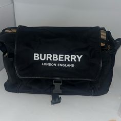 a burberry bag sitting on top of a counter