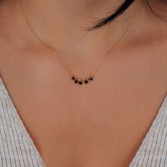 This dainty black onyx necklace is essential to light up your formal look in a delicate way. This onyx station necklace is ultra-light anda good choice for the minimalist jewelry movement. Black stones measures 3mm in width. The adjustable chain with its 2" extender secures with a spring-ring clasp. Due to its delicate design, good care of your jewelry is advised for long use. This onyx necklace is super gift for the women.  PRODUCT DETAILS  * Material: 14K Solid Gold (real solid gold, no gold-f Trending Mangalsutra Designs, Black Stone Necklace, Mangalsutra Chain, Black Beaded Necklace, Delicate Gold Jewelry, Gold Mangalsutra, Anniversary Gift For Wife, Black Onyx Necklace, Black Stones