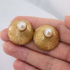 This fabulous pair of retro whale-back cufflinks feature large gold domes with a Florentine finish.  Each cufflink is set with a saltwater Akoya pearl accent.  The cufflinks are crafted in 14k yellow gold. Pearl Cufflinks, Akoya Pearls, Cufflinks, Yellow Gold, Yellow, Gold